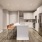 a kitchen with an island and chairs