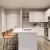 a kitchen with an island and chairs