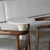 two chairs and a bench with a table